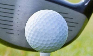 A golf club and ball